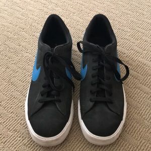 Gently used men’s black suede Nike shoes.